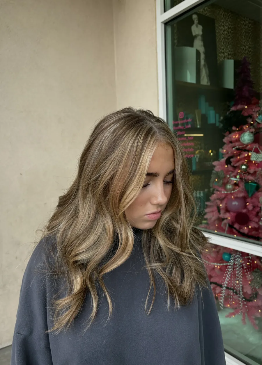Long blonde hair with darker roots and softly blended highlights from Kyrin’s portfolio