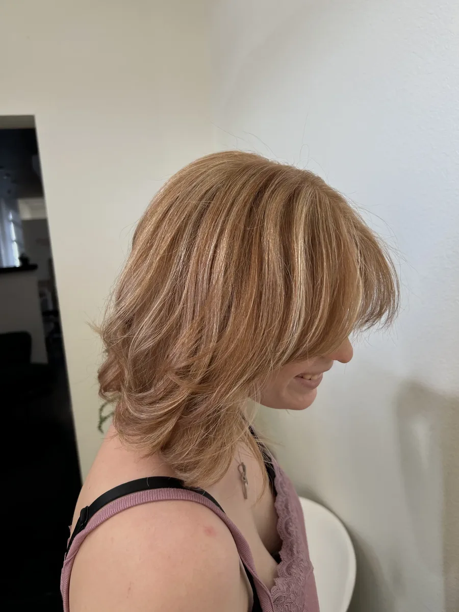 Shoulder-length layered hair with highlights and a softly styled finish from Kyrin’s portfolio